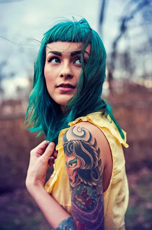 A striking editorial portrait blending bold color, personal style and raw character—captured by TH ARTWORK.